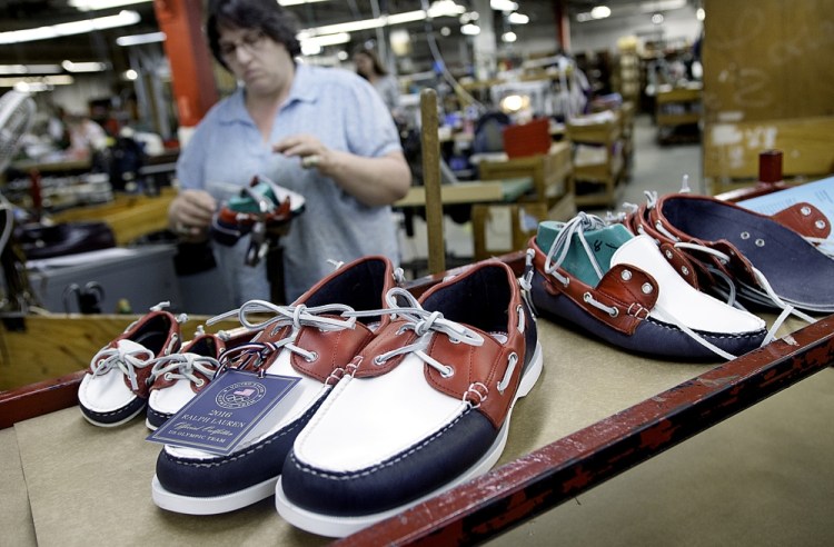 Jewel Rowe hand sews a boat shoe at Rancourt & Co. in Lewiston on Monday. The shoe is identical to those that will be worn by the U.S. Olympic team during opening and closing ceremonies in Brazil.