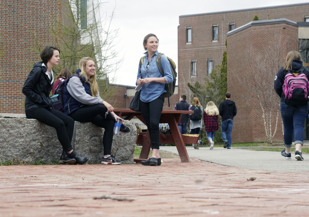 University of Maine students gather Tuesday on the Orono campus. The number of out-of-state students at UMaine will rise from 731 last year to at least 1,123 in 2016-17.