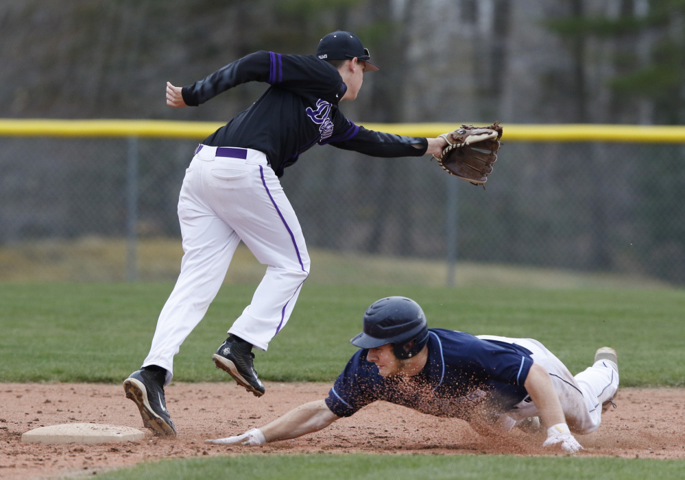 Corey Walker of Westbrook steals second base Tuesday as Mitchell York of Deering attempts to haul in the throw during Deering's 3-2 victory. The Rams improved to 4-1 and dropped the Blue Blazes to 1-3.