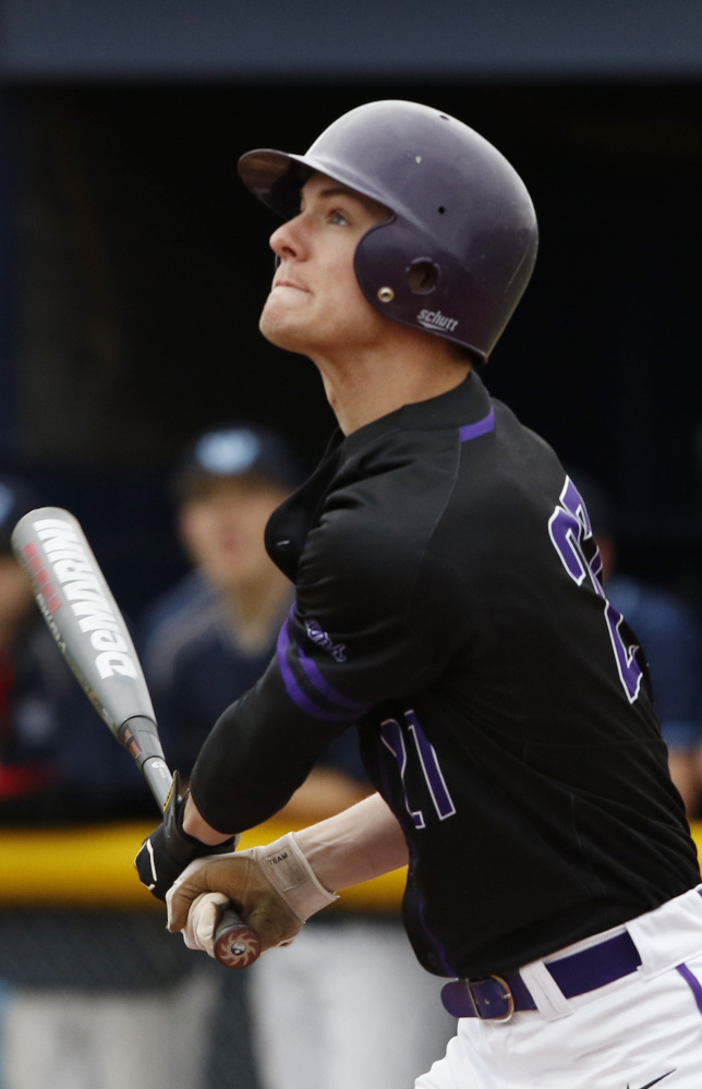 Orey Dutton of Deering watches the flight of the ball during the first inning of the game at Westbrook. Pitchers James Sinclair and Colby Dame of Deering combined to shut the Blue Blazes down, giving up a total of four hits.