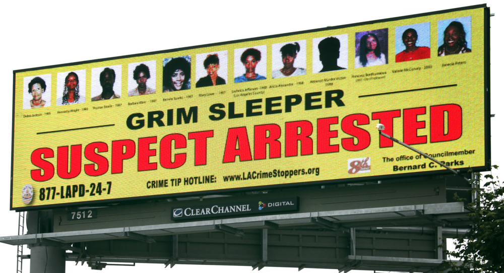 A billboard bearing the photos of the victims and showing that the suspect known as the "Grim Sleeper" had been arrested stands near a freeway in Compton, Calif.