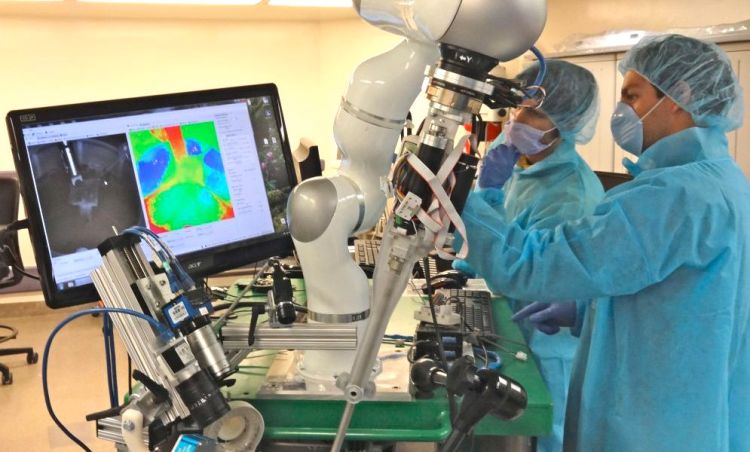 This photo provided by Axel Krieger/Science Translational Medicine shows an autonomous procedure being performed by a robot in testing. The Associated Press