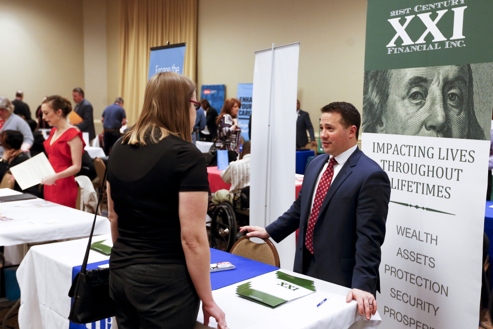 Prospective employers and job seekers meet at a Job Fair in Pittsburgh in March. Weak U.S. economic growth may have made some employers more cautious about hiring in April.