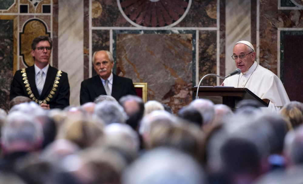 Pope Francis accepts a prize for promoting European unity on Friday and bemoans that the continent's people "are tempted to yield to our own selfish interests and to consider putting up fences."