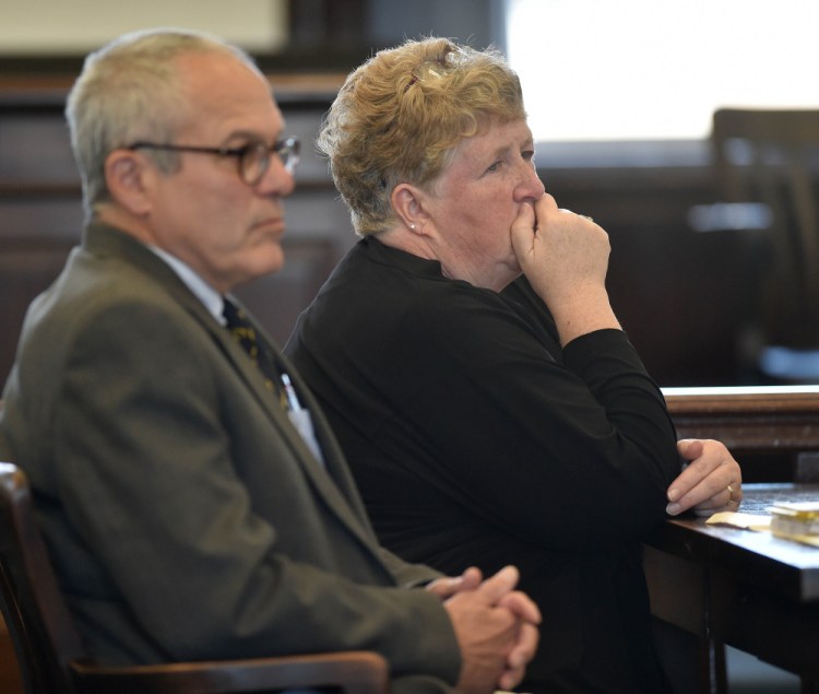 Julie Smith sits next to her attorney, Woody Hanstein, as she listens to Superior Court Justice Robert Mullen on Friday in Somerset County Superior Court in Skowhegan.