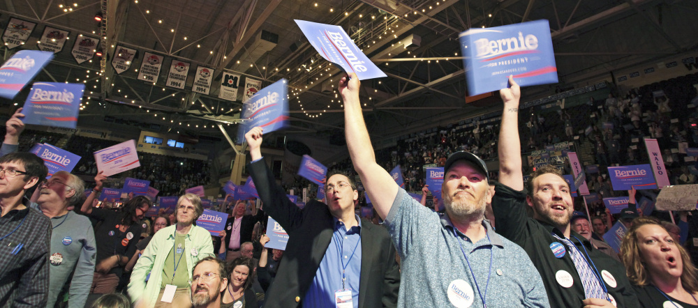 Backers of presidential candidate Sen. Bernie Sanders cheer a speech by Troy Jackson of Allagash, a former state senator who is a representative to the Democratic National Committee, during the party's convention at Cross Insurance Arena on Saturday.