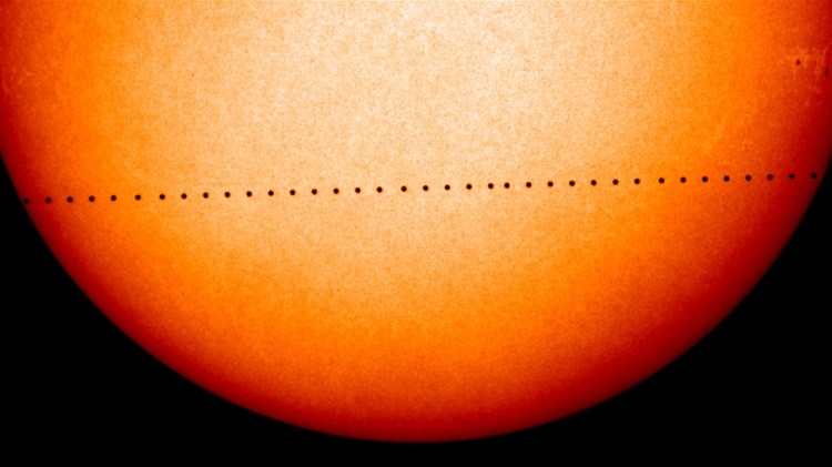 This composite image of observations by NASA and the ESA's Solar and Heliospheric Observatory shows the path of Mercury during its November 2006 transit. On Monday, May 9, 2016, the solar system's smallest, innermost planet will resemble a black dot as it passes in front of the Sun. NASA says the event occurs only about 13 times a century.