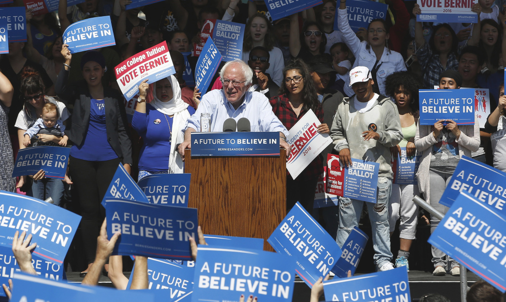 Sign-waving fans show their support for Democratic presidential candidate Bernie Sanders at a campaign rally Tuesday in Stockton, Calif. The state's primary is scheduled for June 7.