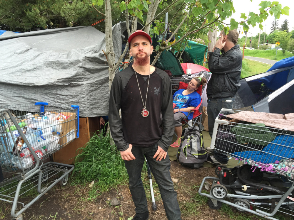 Robert Mendez has been living in this tent camp off the Springwater Corridor, a biking path, in southeast Portland. Under a new safe-sleep policy, shelters are allowed to be set up at night on sidewalks and right-of-ways but must be taken down during the day.