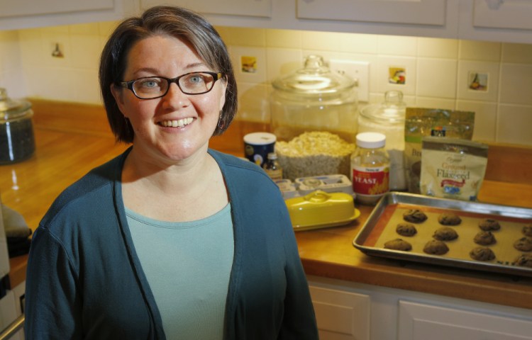 Postpartum doula Jessica Thomas. In the background are some of Thomas' lactation cookies.