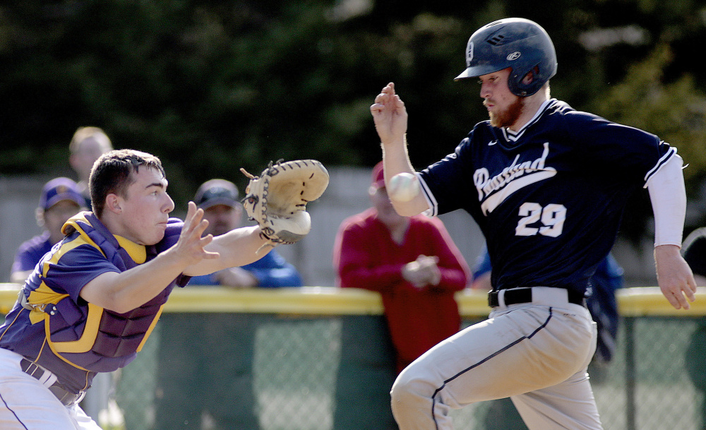 Cheverus catcher Logan McCarthy takes the throw, but too late to get John Williams of Portland, who scored the tying run in the fourth inning Thursday. The Bulldogs scored two more runs in the inning and went on to an 8-1 victory over the Stags.