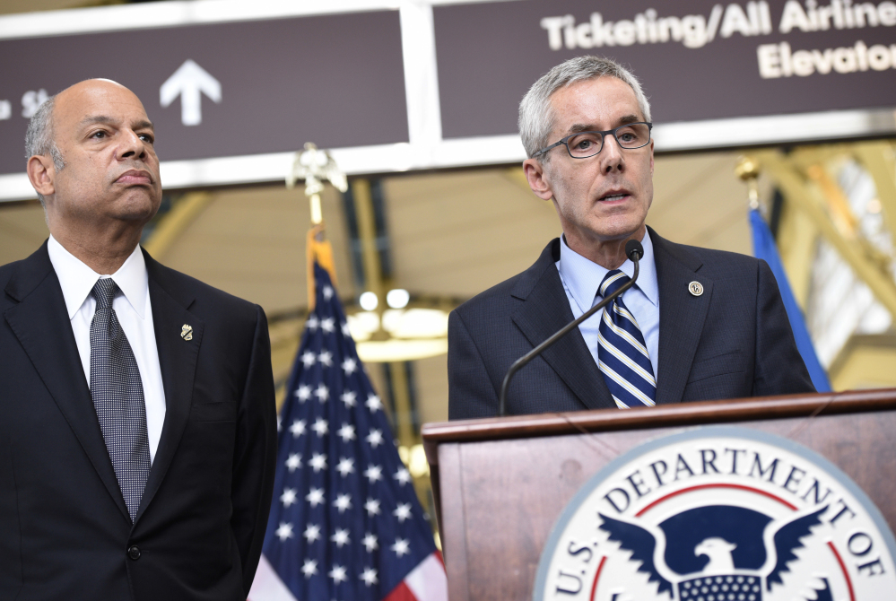 Transportation Security Administration's Peter Neffenger, right, and Homeland Security's Jeh Johnson speak at a news conference Friday.