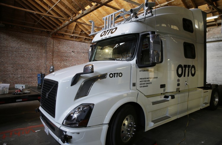 A driverless Otto truck cab sits in a garage in San Francisco. The startup company is aiming to equip trucks with software, sensors, lasers and cameras so they can navigate highways, with a goal of more reliable and safer travel.