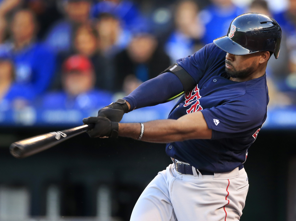 Boston's Jackie Bradley Jr. hits a solo home run off Royals starter Edinson Volquez in the second inning of a Wednesday's second game of a doubleheader in Kansas City, Mo. The hit extended Bradley's hitting streak to 24 games.