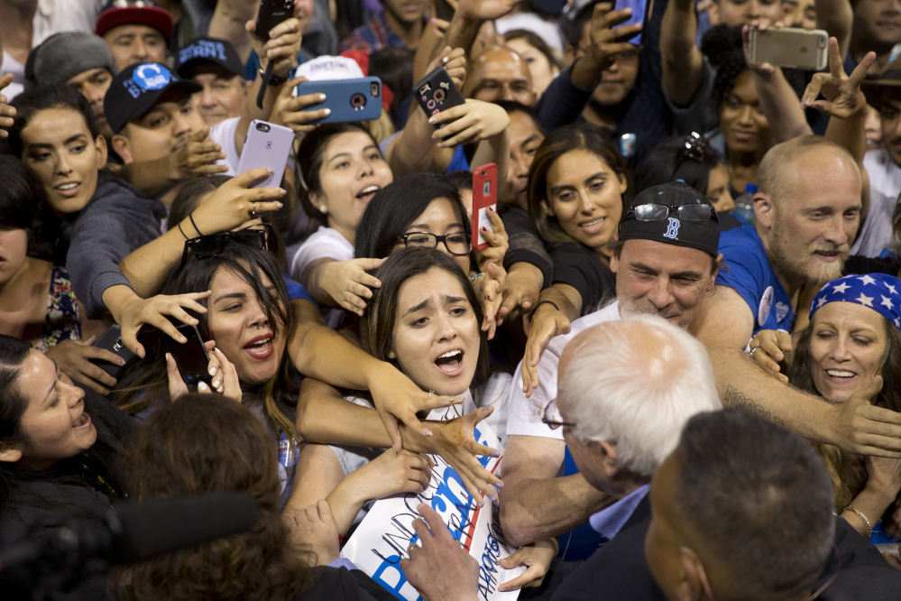 Democratic presidential candidate Sen. Bernie Sanders, I-Vt., greets supporters after speaking at a rally on Tuesday in Carson, Calif. As Kentucky slid away from Sanders on Tuesday, some of his supporters turned on the state's secretary of state.
