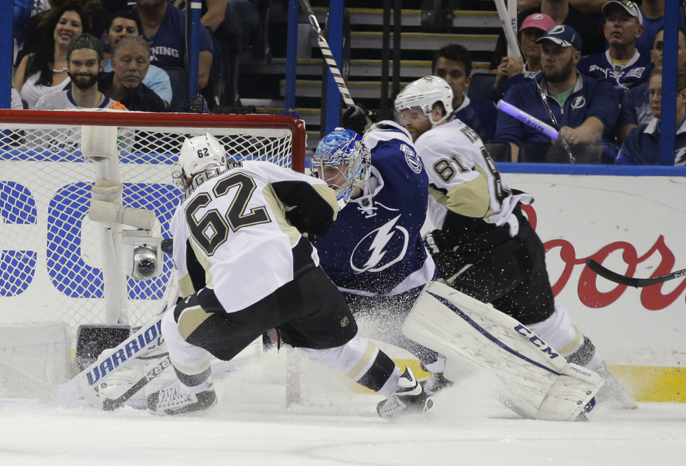 Pittsburgh left wing Carl Hagelin scores a goal against Tampa Bay Lightning goalie Andrei Vasilevskiy in the second period of Game 3 of the Eastern Conference finals Wednesday night in Tampa, Fla.
