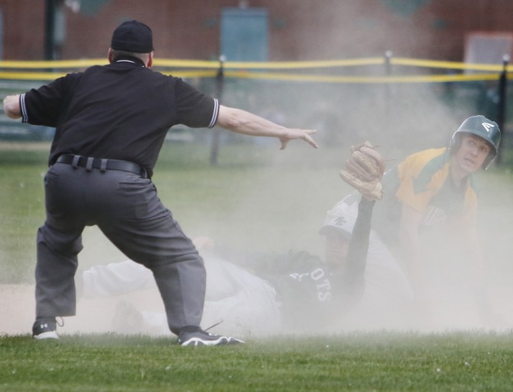 Weston Bergeron of Massabesic is called safe at second base as Cam Robinson of Bonny Eagle holds up the ball Thursday during Bonny Eagle's 2-1 victory in nine innings.