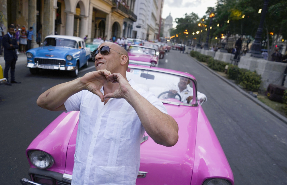 Actor Vin Diesel shows Cubans the love this month during a Chanel fashion extravaganza in Havana. Many on the island are exuberant about the attention, but others worry that it won't bring a struggling people "real, concrete benefits."