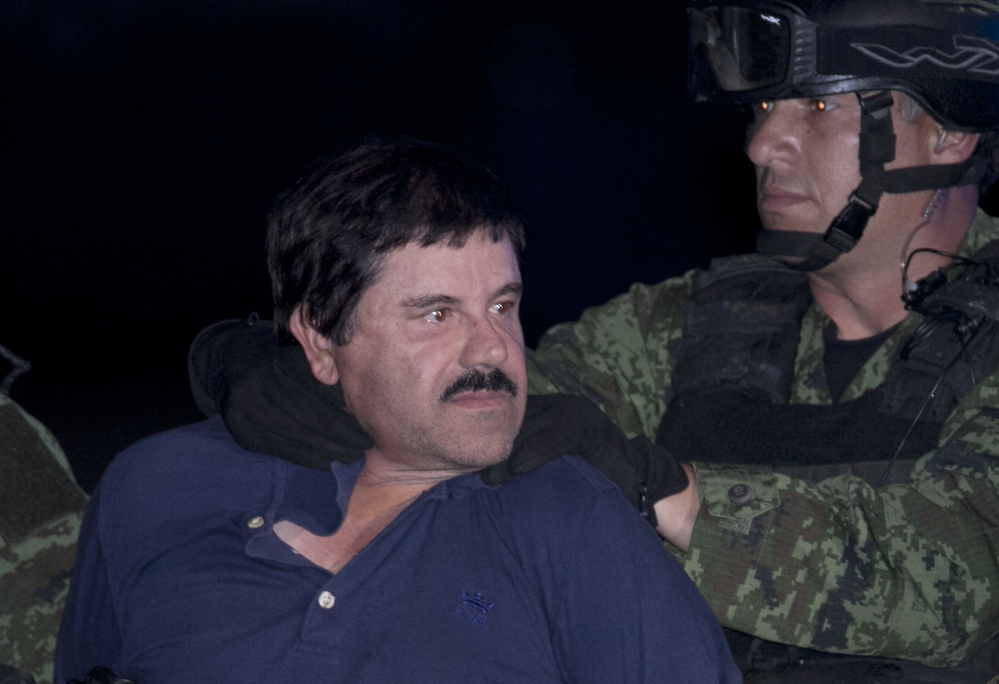 Joaquin "El Chapo" Guzman was escorted in handcuffs by Mexican soldiers
at a federal hangar in Mexico City, Mexico, in January, but is now being held near the Texas border.
The Associated Press