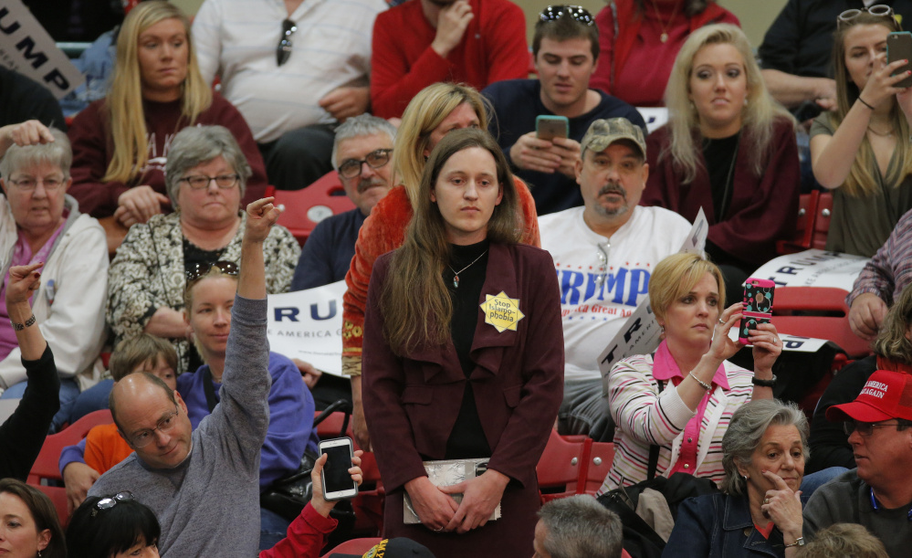 While white women have been shifting to the Republican Party in recent years, Donald Trump's candidacy could have many reconsidering their alliances, among them a woman standng in protest at a Trump rally in Concord, N.C., in March.