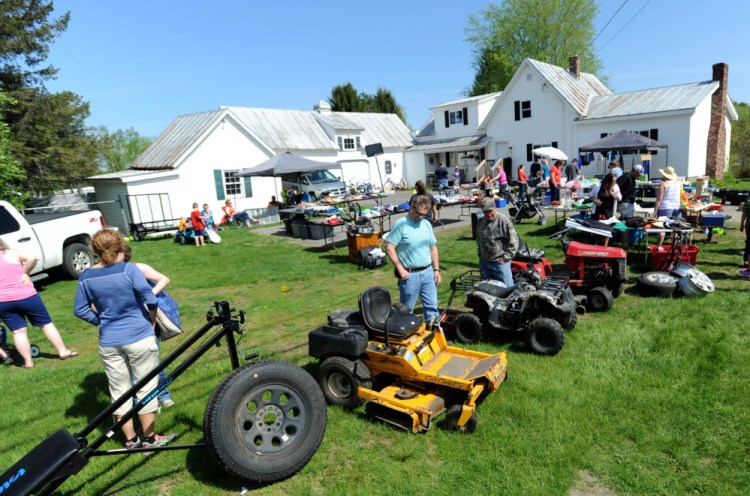 Shoppers browse among the abundant merchandise for sale Saturday in Cornville's highly popular annual yard sale. Begun 33 years ago, the event has sprawled into Skowhegan and Athens. "It always amazes me how well we do," one vendor said..