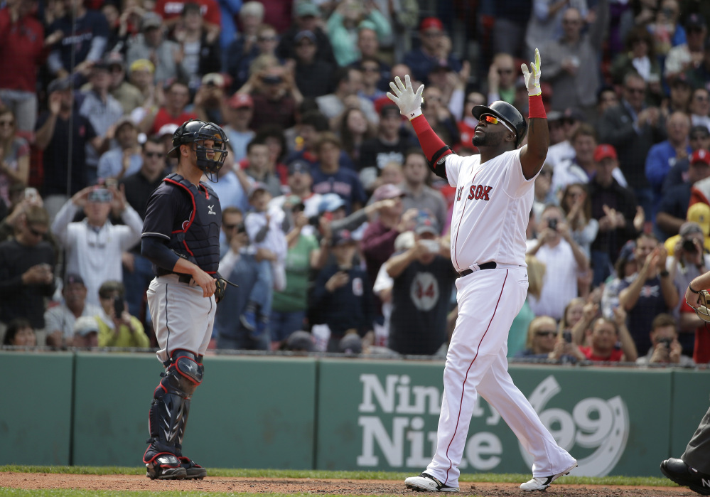 The Associated Press
Red Sox designated hitter David Ortiz celebrates after hitting a home run in the fifth inning of Boston's 5-2 win over Cleveland on Sunday at Fenway Park.