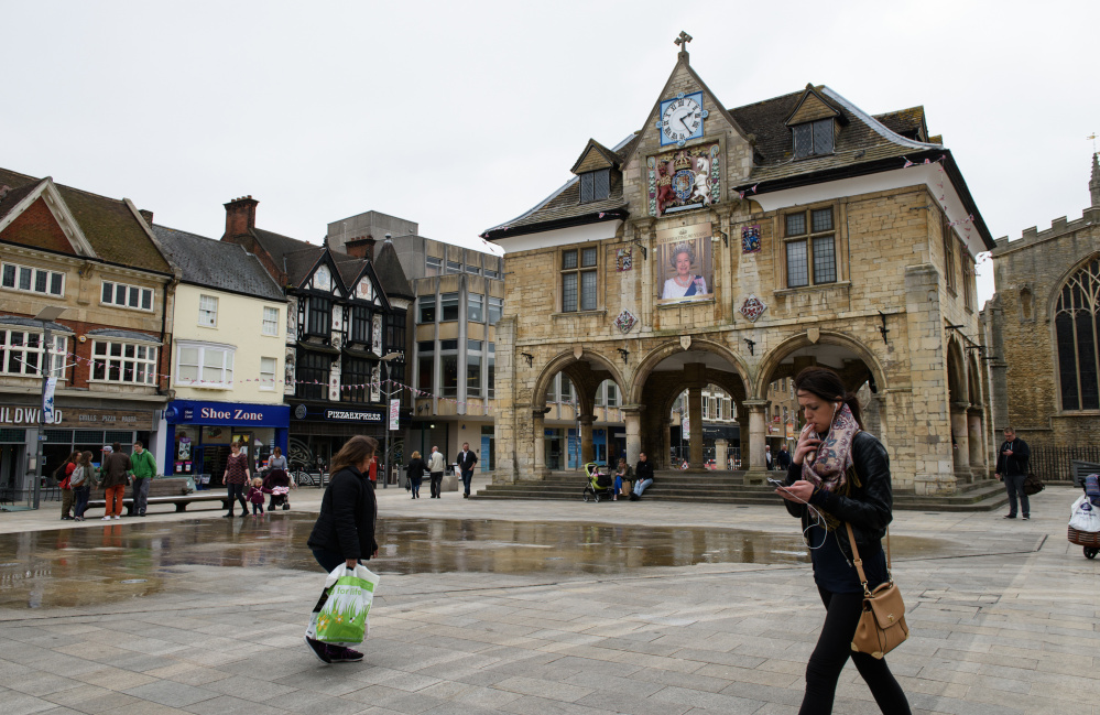 A portrait of Queen Elizabeth II overlooks a square in central Peterborough in England. Peterborough was rated in a recent poll as the second-most Eurosceptic place in Britain.