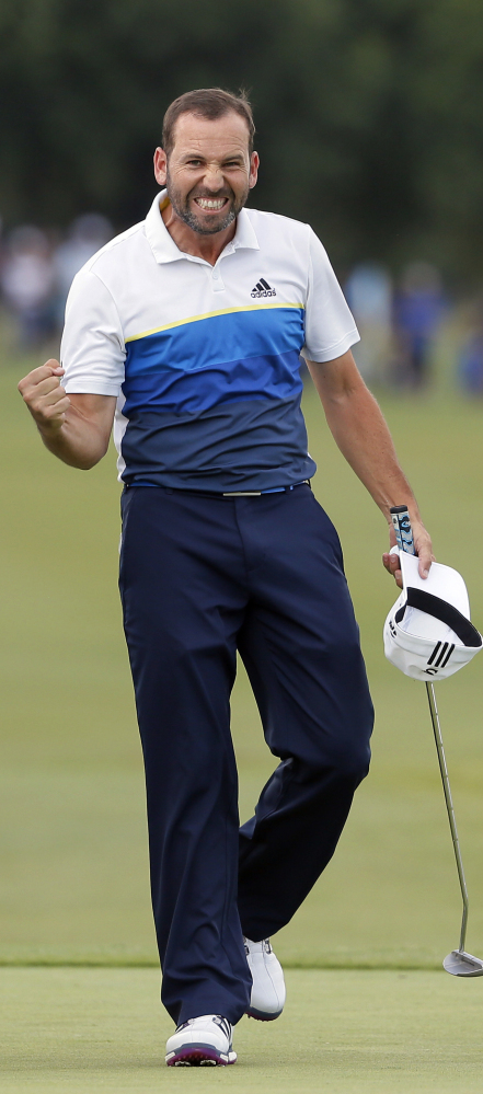 Sergio Garcia celebrates after sinking a par putt on the first playoff hole to win the Byron Nelson tournament for the second time, in Irving, Texas.