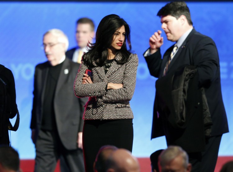 Huma Abedin, center, aide to Hillary Clinton, stands on stage after a Democratic presidential primary debate in Manchester, N.H., in this 2015 file photo. FBI agents probing whether Hillary Clinton's use of a private email server imperiled government secrets appear close to completing their work, a process experts say will likely culminate in a sit-down with the former secretary of state.
