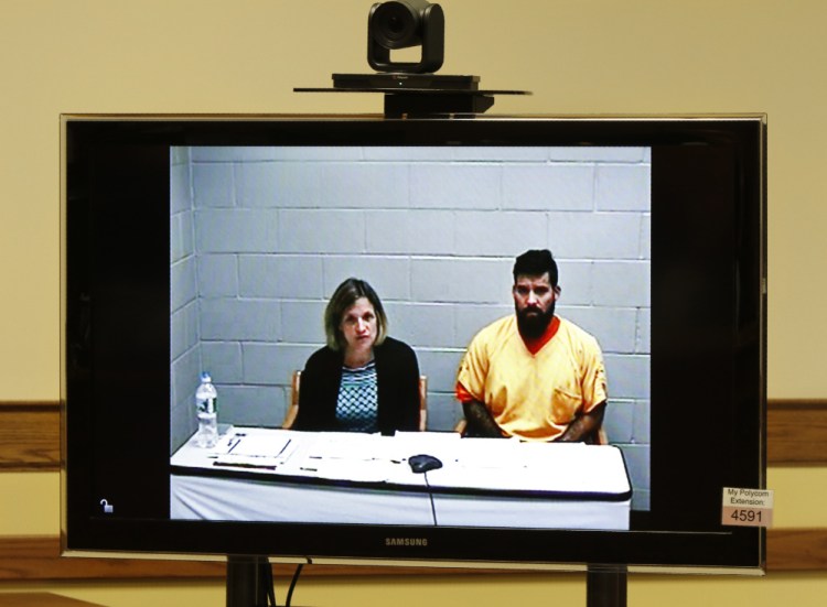Robert Ferrera III, with court-appointed attorney Lisa Chmelecki, appears in Springvale District Court via video link from the York County Jail on Monday.