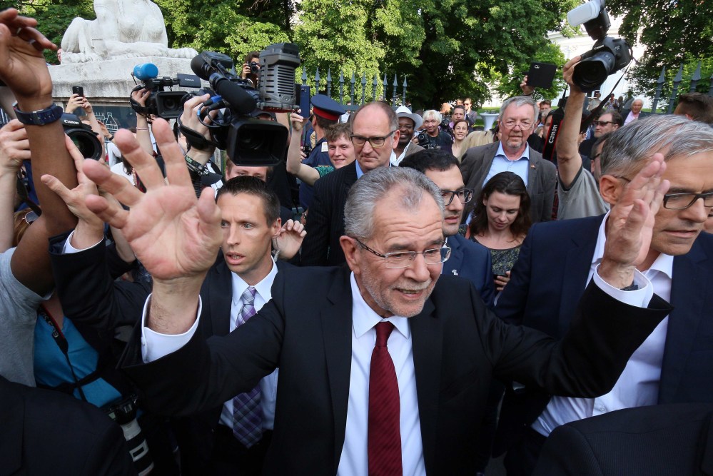Alexander Van der Bellen winner of Austria's presidential election waves to his supporters in Vienna, Austria, Monday, May 23, 2016. Left-leaning candidate Alexander Van der Bellen won the election to become Austrian president Monday, but his right-wing rival was only narrowly behind, a result that reflects the growing strength of Europe's anti-EU political movements.  (AP Photo/Ronald Zak)
