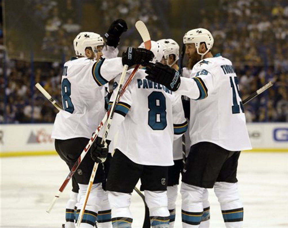 Sharks center Tomas Hertl, left, celebrates after scoring a first-period goal in Game 5 of the Western Conference against the Blues at St. Louis.