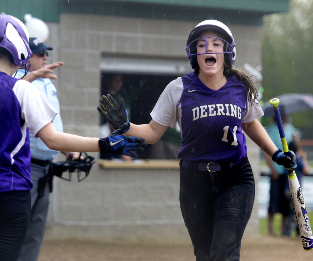 Mackenzie O'Donnell of Deering is welcomed back to the dugout after scoring against Bonny Eagle at Standish. Deering improved its record to 3-12 and dropped the Scots to 6-9.
Derek Davis/Staff Photographer