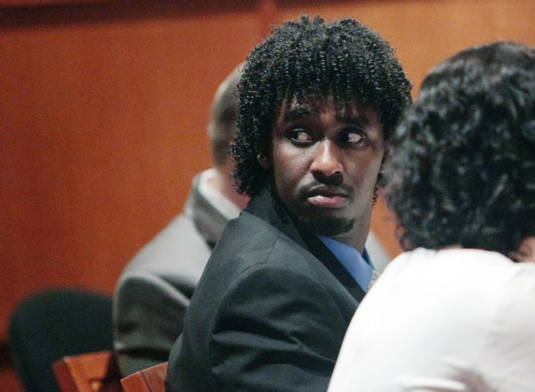 Abdirahman Haji-Hassan, 25, who is charged in the 2014 shooting of Richard Lobor in Portland, appears with his attorney for a pretrial hearing Thursday in the Cumberland County Courthouse.
