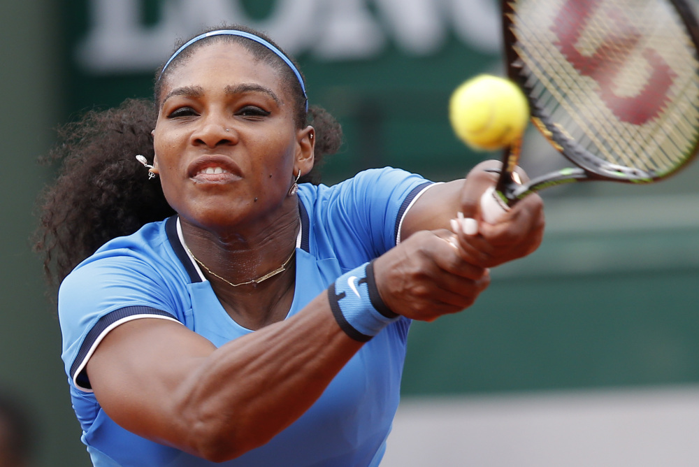 Serena Williams returns the ball to Brazil's Teliana Pereira during their second round match of the French Open tennis tournament at the Roland Garros stadium on Thursday. Williams won the match in straight sets.