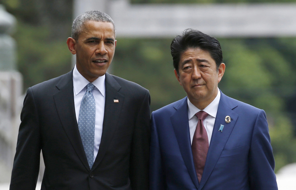 President Obama talks with Japan's Prime Minister Shinzo Abe on the Ujibashi bridge as they visit the Ise Jingu shrine in Ise, Japan, on Thursday.