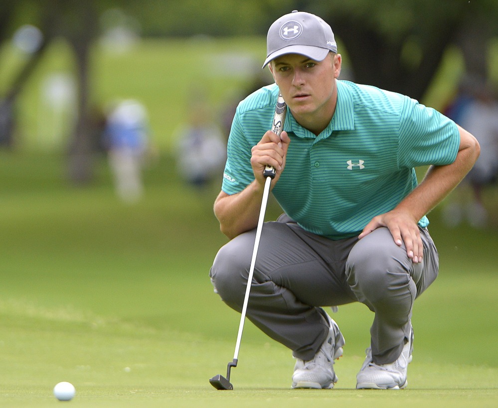 Jordan Spieth lines up a shot on the first green during the Dean & Deluca Invitational golf tournament at Fort Worth, Texas on Thursday. Spieth is three shots off the lead.