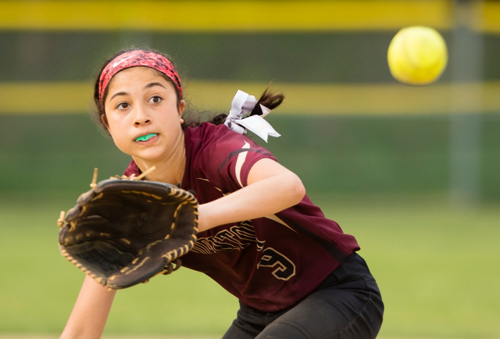 Thornton Academy pitcher Louissa Colucci fields a  ball in the sixth inning Monday.
Photo by Carl D. Walsh/Staff Photographer