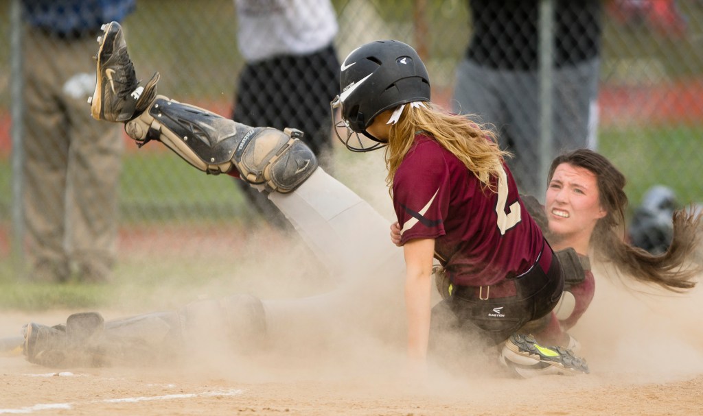 Windham catcher Sadie Nelson is on the ground after tagging Thornton Academy 's Taylor Paquette during the fifth inning Monday in Saco.
Carl D. Walsh/Staff Photographer