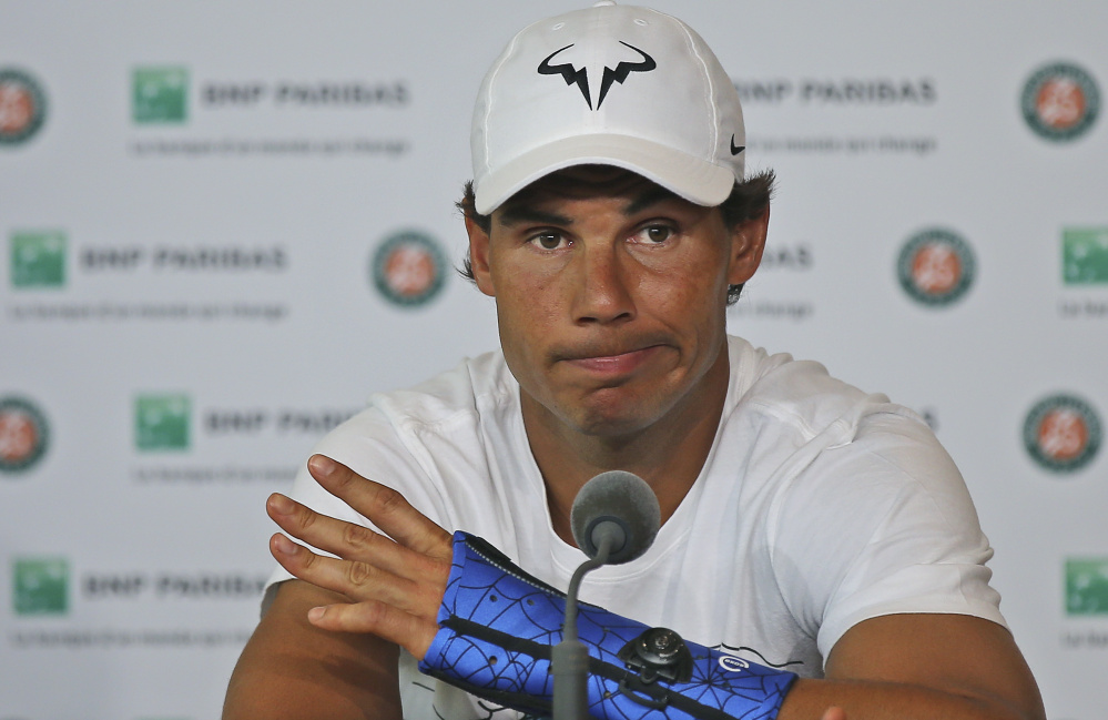 Rafael Nadal first injured his left wrist during a match in Madrid earlier this month and the pain grew worse during the French Open. The nine-time champ said his doctor told him winning five more matches was "100 percent impossible."