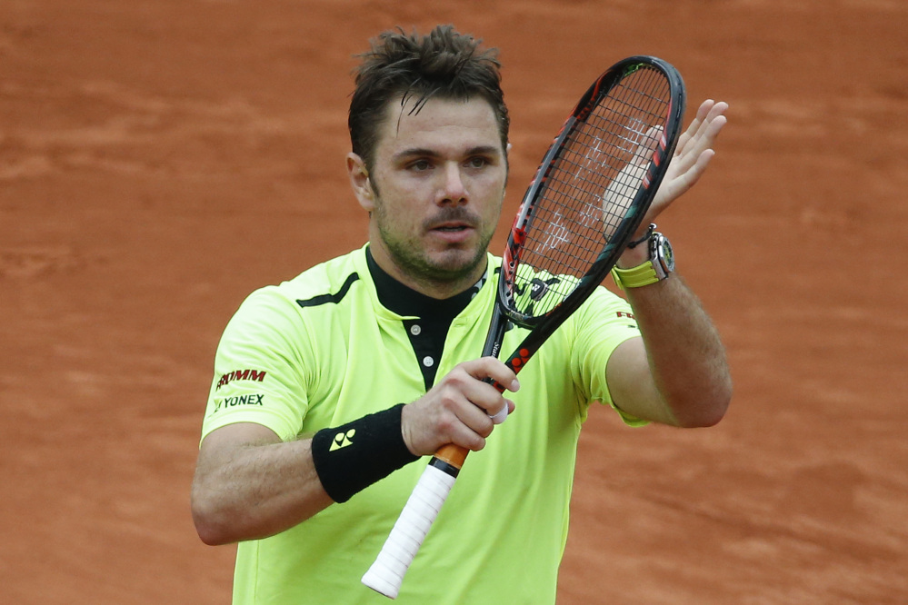Stan Wawrinka celebrates winning the fourth-round match against Viktor Troicki at the French Open on Sunday in Paris.