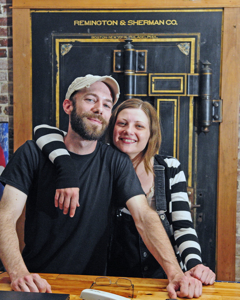 Buddy Iaciofano, left, and Becky Havens pose in front of the large safe that houses a walk-in cooler in the former Hattie's Chowder House on Tuesday May in Hallowell. They plan to reopen as Buddy's Diner in the space that used to be a bank branch on the corner of Water and Winthrop streets.