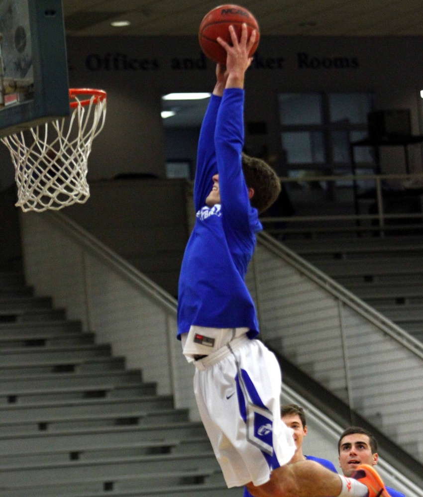 Contributed photo/Colby athletics 
 Colby College guard Pat Dickert goes up for a dunk prior to a game last season. Dickert, who is listed at 6-foot-2, made national headlines after he posted a video of himself dunking from behind a foul line.