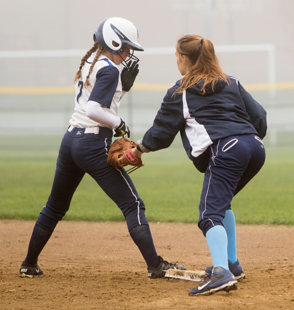 Yarmouth's Colleen Sullivan gets back safely to second as York center fielder Julia Herrod applies a late tag during Friday's game at Yarmouth.
Carl D. Walsh/Staff Photographer
