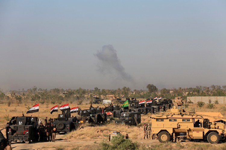 Iraqi military forces prepare for an offensive into Fallujah to retake the city from Islamic State militants.