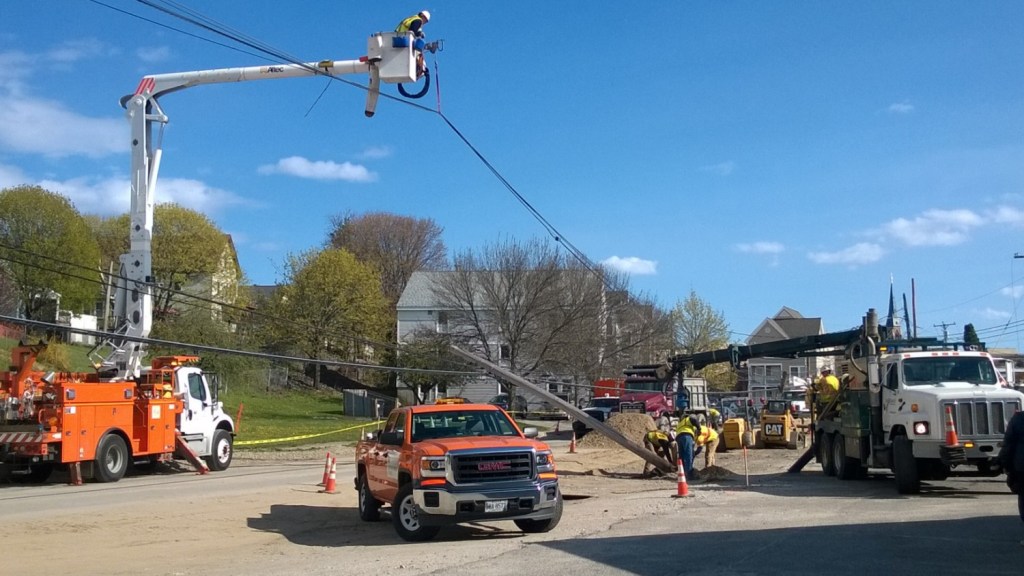Anderson Street between Fox Street and Marginal Way in Portland was shut down after a construction vehicle knocked over two utility poles Monday.