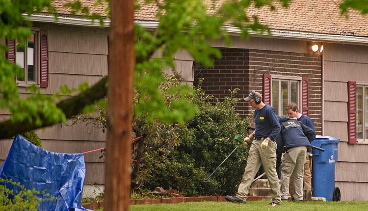 Federal agents search the home of reputed mobster Robert Gentile, Monday in Manchester, Conn. Prosecutors believe Gentile knows about the still-unsolved 1990 art heist at the Isabella Stewart Gardner Museum in Boston. Mark Mirko/Hartford Courant via AP