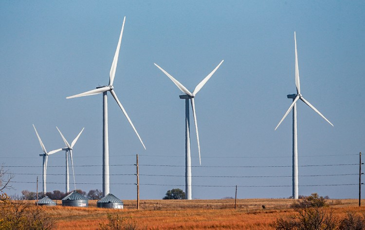 Wind turbines dot the landscape near Steele City, Neb. Wind turbines and solar panels accounted for more than two-thirds of all new electric generation capacity added to the national grid in 2015, according to a recent analysis by the U.S. Department of Energy. The Associated Press