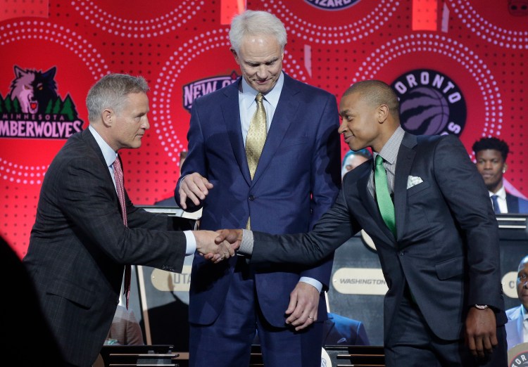 Philadelphia 76ers head coach Brett Brown, left, is congratulated by Boston Celtics guard Isaiah Thomas, right, and Los Angeles Lakers general manager Mitch Kupchak after the 76ers won the top draft pick Tuesday night.   The Associated Press
