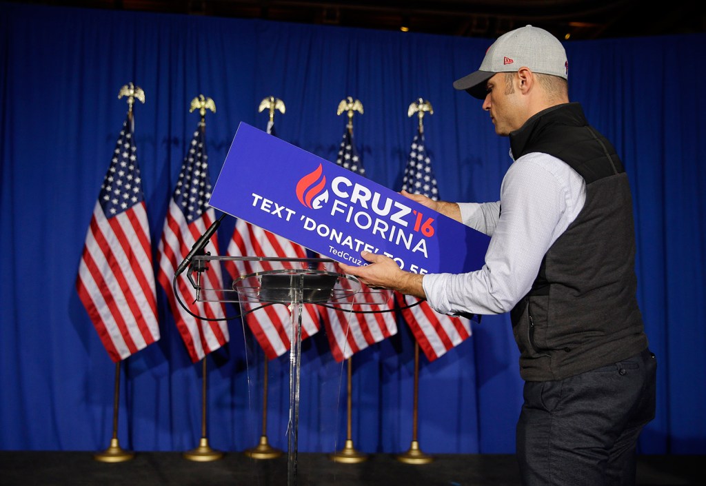 A worker for Ted Cruz removes the campaign sign from the podium after Cruz's speech in Indianapolis in which he announced the end of his presidential campaign.
The Associated Press